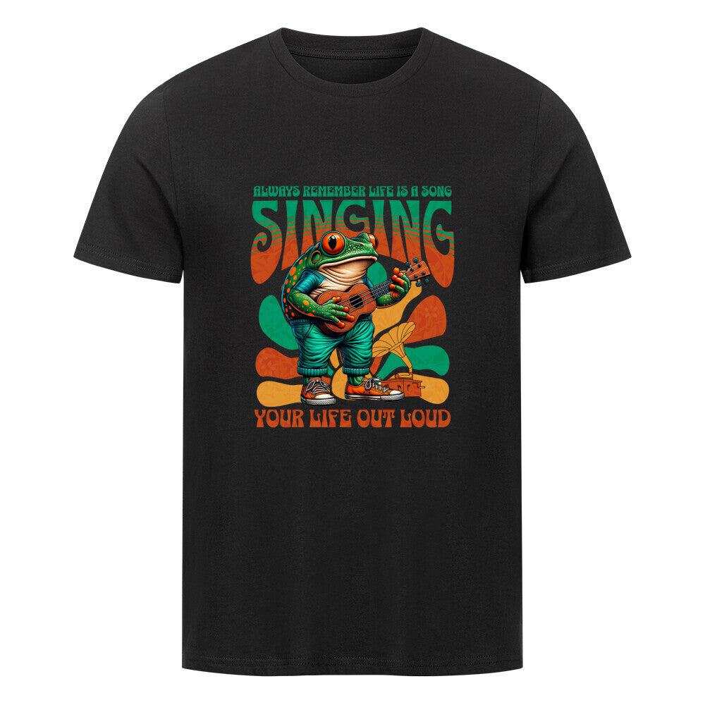 Kanimal "Singing" T-Shirt für Herren, 100% Bio-Baumwolle, Unisex-Schnitt – Dieses fröhliche T-Shirt in schwarz der Marke Kanimal zeigt einen Frosch, der eine Ukulele spielt, begleitet vom Schriftzug "Always remember life is a song, singing your life out loud" in einem farbenfrohen Retro-Design. Das lebhafte Motiv ist perfekt für Musik- und Naturliebhaber. Hergestellt aus 100% gekämmter Bio-Baumwolle, normaler Passform, eingesetzten Ärmeln und 1x1 Rippstrick am Ausschnitt.